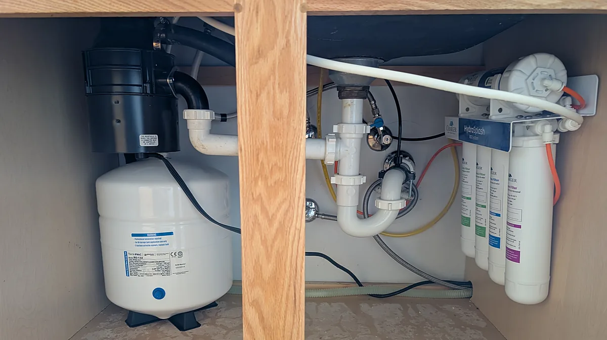 Charger HydroSplash under-sink reverse osmosis system with storage tank, installed in a kitchen cabinet